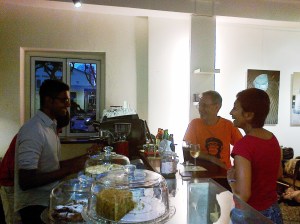 Prashant of Artistry Cafe chatting with Pete Kellock and Pearl Samuel